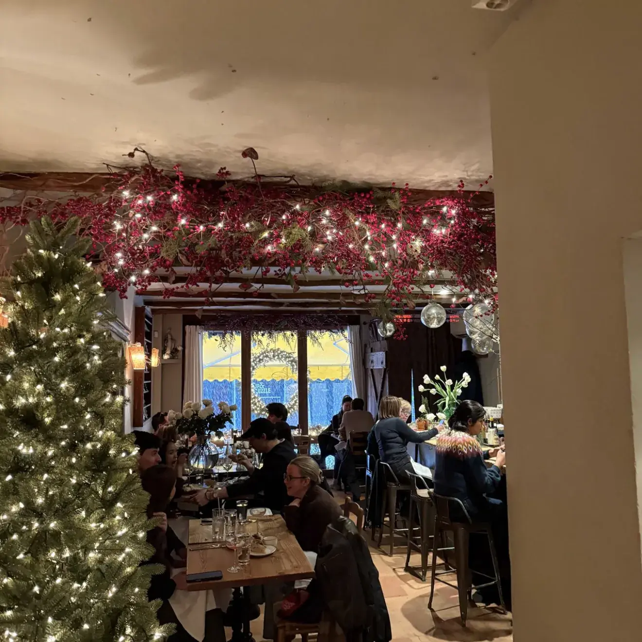 Guests gathered in a warmly lit private dining room