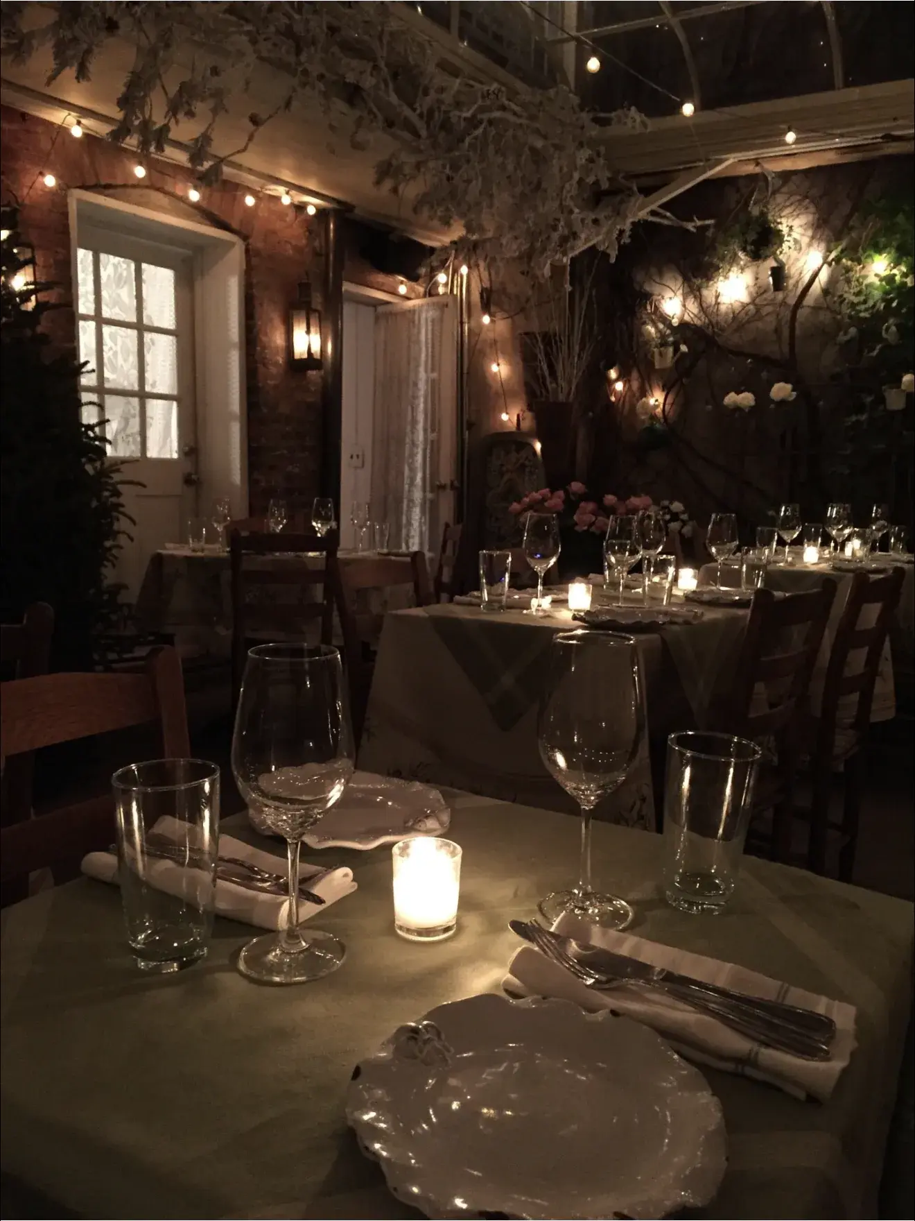A candlelit dining room setting for The Dorset